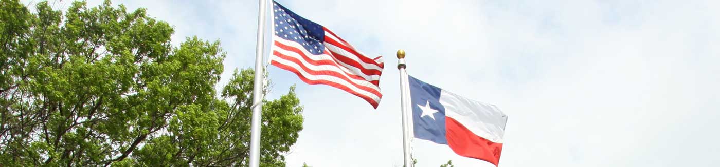 USA and Texas Flags flying high